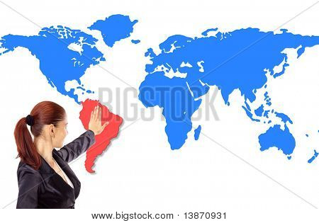 Happy young woman pointing on map