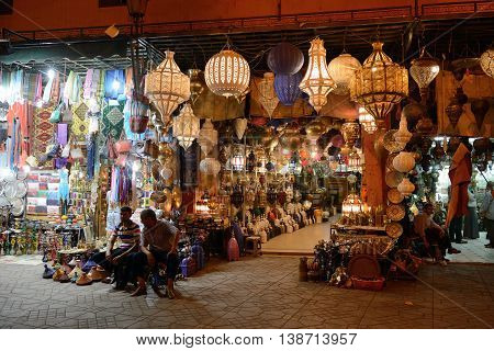 MARRAKESH - JULY 09: Unknown people in a market (souk), July 09, 2013 in a Marrakesh, Morocco. The traditional Berber market is one of the most important attractions of the city Marrakesh, Morocco