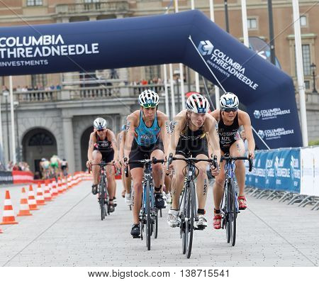 STOCKHOLM - JUL 02 2016: Group of female triathlete cyclists in front of the royale castle in the Women's ITU World Triathlon series event July 02 2016 in Stockholm Sweden