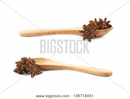 Chinese star anise seed served in a wooden spoon, composition isolated over the white background, set of two different foreshortenings