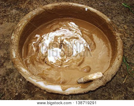 liquid mortar in a basin mixed with lime