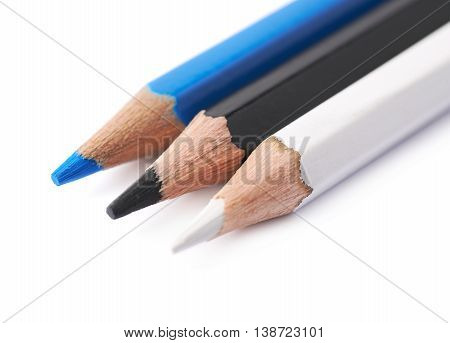 Three drawing pencils composition isolated over the white background, close-up crop fragment