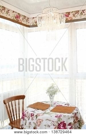 Interior Of Modern Kitchen, View Of A Window And Little Table With Chairs, A Vertical Shot