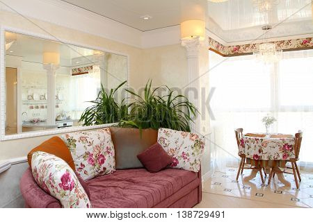 Interior Of The Modern Apartment Overlooking A Big Window, A Mirror And A Sofa, A Horizontal Shot