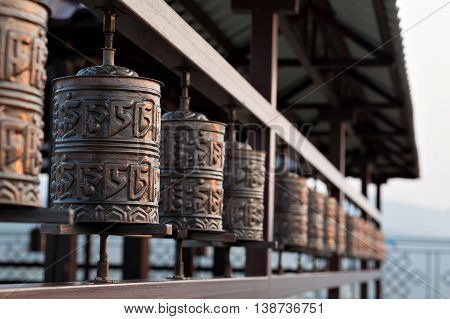 Religious prayer wheel for meditation in a Buddhist temple in Buryatia, Russia Ulan-Ude.