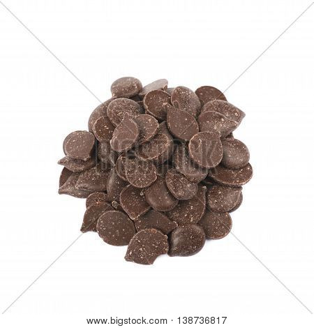 Pile of cooking chocolate teardrop shaped chips isolated over the white background