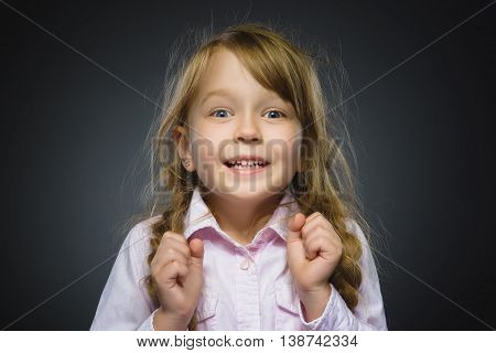Closeup Portrait of happy girl going surprise isolated on gray background.