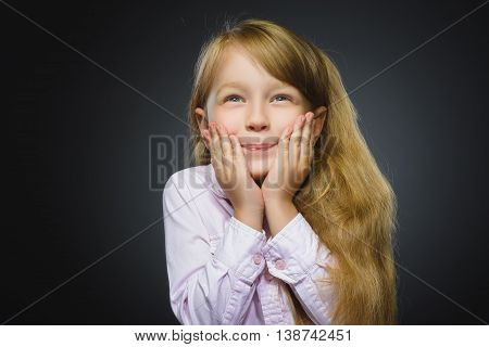 Closeup Portrait of happy girl going surprise isolated on gray background.