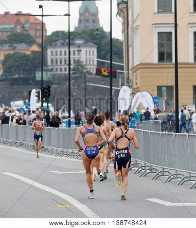 STOCKHOLM - JUL 02 2016: Rear view of group of running triathletes in the Women's ITU World Triathlon series event July 02 2016 in Stockholm Sweden