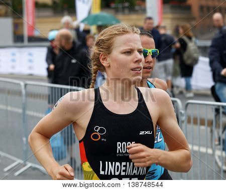 STOCKHOLM - JUL 02 2016: TCloseup of triathlete Laura Lindemann running in the Women's ITU World Triathlon series event July 02 2016 in Stockholm Sweden