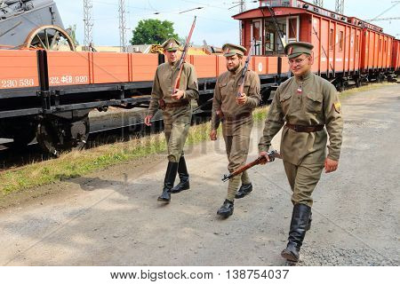 DOBRANY CZECH REPUBLIC - JUNE 17, 2016: Unidentified soldiers in historic Czech legionary uniforms as a guard of military armoured train. Historical reenactment. Reconstruction of russian civil war.