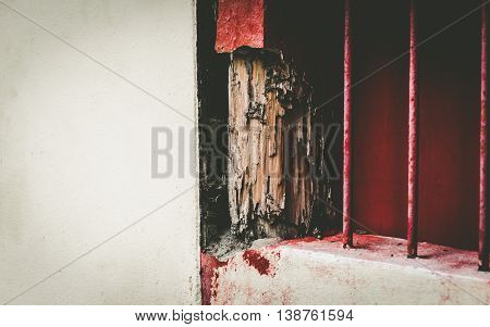 Old Wood window frames decaying, red painted