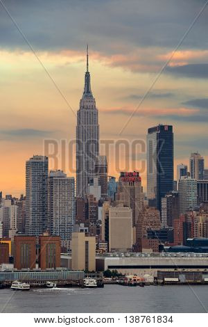 NEW YORK CITY - JUL 4: Empire State Building with skyscrapers on July 4, 2015 in Manhattan, New York City. With population of 8.4M, it is the most populous city in the United States.