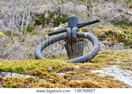 Old anchor ring found on a island. Set in rock. Used to anchor ships but not used anymore.