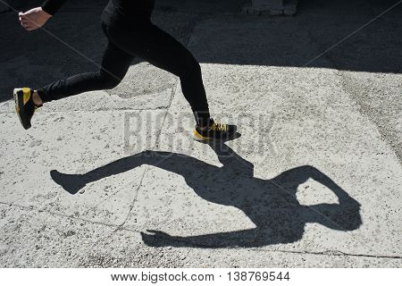 The legs of a runner at the time of running