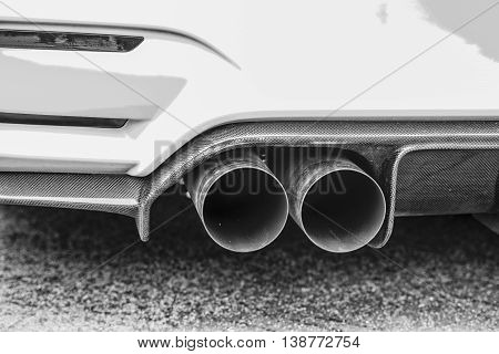 Double Exhaust Pipes Of A Modern Sports Car, Black And White