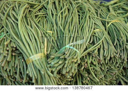 fresh green bean selling on vegetable market