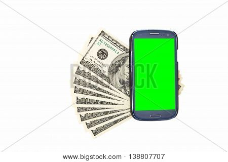 Smartphone lying on the United States dollars, isolated on a white background