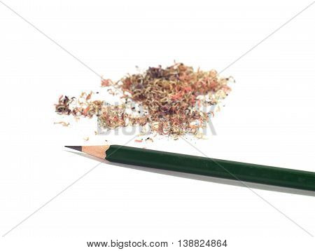 sharpened green pencil with a pile of pencil sawdust isolated on white background