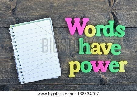 Words have power word on wooden table