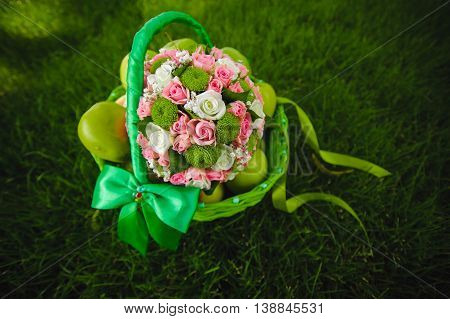 Close view of beautiful colorful wedding bouquet with green apple
