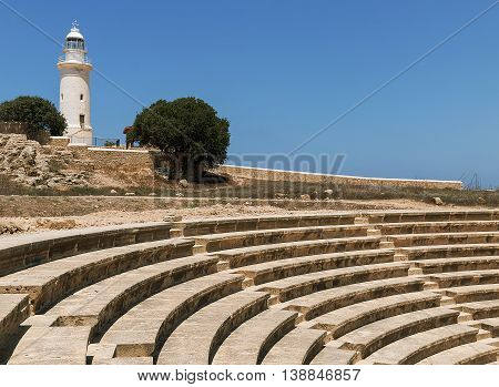 Ancient Odeon Amphitheatre with lighthouse in Paphos, Cyprus