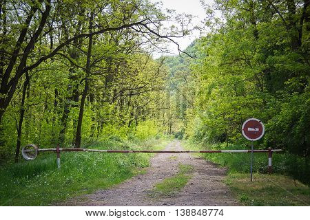 The barrier and the stop sign at the border