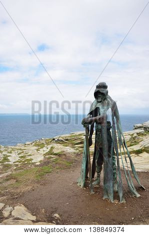 Tintagel Cornwall United Kingdom - July 01 2016: Gallo statue overlooking cornish coast at Tintagel. Inspired by Legend of King Arthur