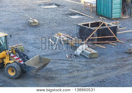 View of a construction site with various machines and bulldozers