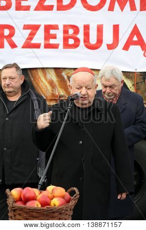 CRACOW POLAND - DECEMBER 20 2015: Cardinal Stanislaw Dziwisz during Christmas Eve for poor and homeless on the Central Market in Cracow.