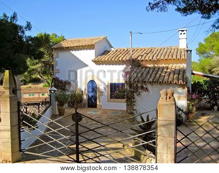 Finca with patio and gate - blue sky