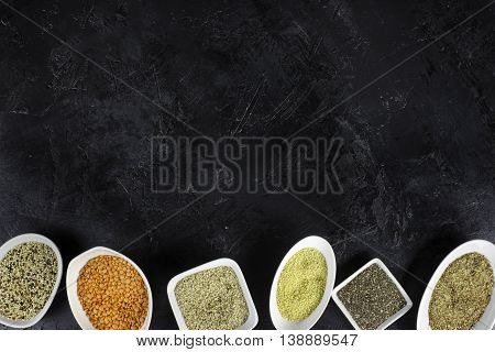 super food in bowls on dark ground