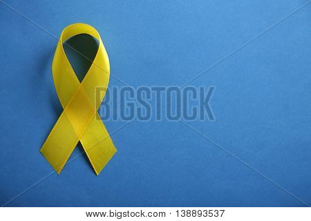 Yellow ribbon on blue background