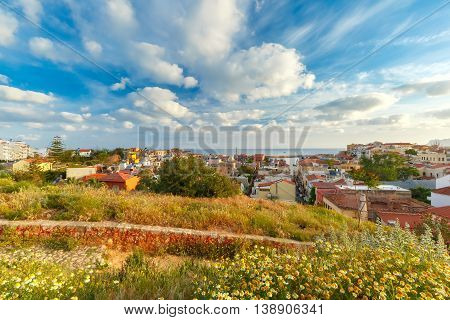 The medieval city with lighthouse in old harbour, aerial view from Schiavo Bastion in the evening, Crete, Greece