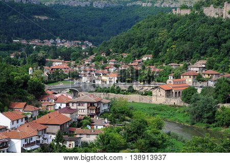 VELIKO TARNOVO BULGARIA - JUNE 26 2016: Residential area of Veliko Tarnovo Tsarevets fortress wall and the Yantra river