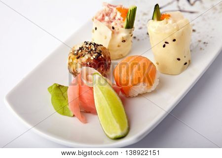 Set of different sushi on white background