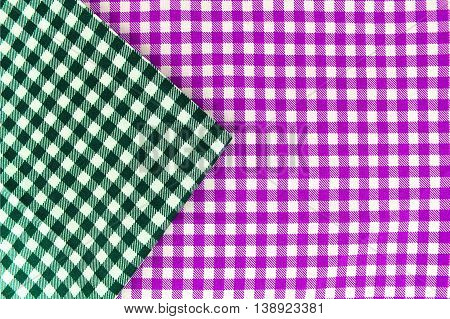 Wooden table covered with tablecloth. View from top. Empty tablecloth for product montage. Free space for products and for your text