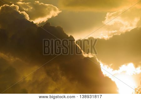 Background Of Golden Storm Clouds At Sunset.