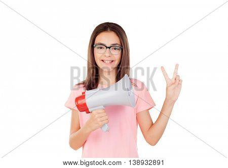 Pretty preteenager girl with a megaphone isolated on a white background