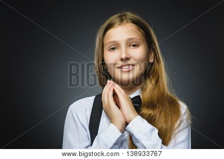 Closeup Portrait of happy girl going surprise isolated on gray background.