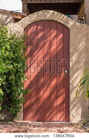 Round Top Closed Plank Gate In Gate With Arch
