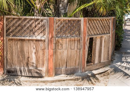Natural Wood Privacy Fence With Diagonal Board On Board Picket Top