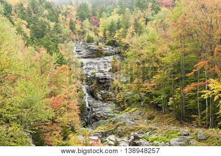 Silver Cascade drops down New Hampshire mountainside on rainy morning