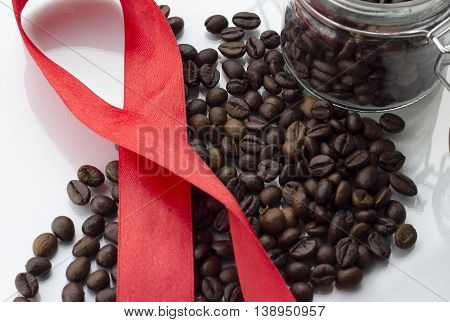 heap of coffee beans isolated on a white background from glass jar