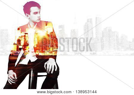 Thoughtful young businessman on city background with copy space. Double exposure