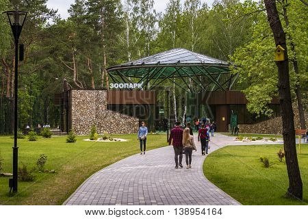 RUSSIA, BELGOROD - JUNE 13 2016: New Belgorod zoo in the woods. Walkway in front of the entrance.