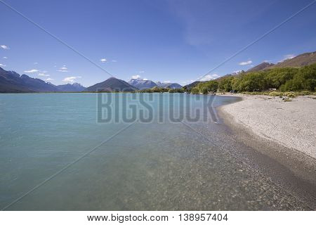 The Dart River, Glenorchy, flows through rugged forested country in the southwestern South Island of New Zealand