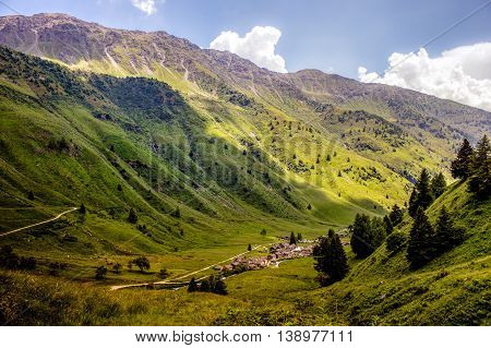 Clouds Cover Village On A Mountaing View (ponte Di Legno, Case Di Viso - Italy)