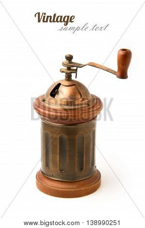 Vintage metal coffee grinder on white background