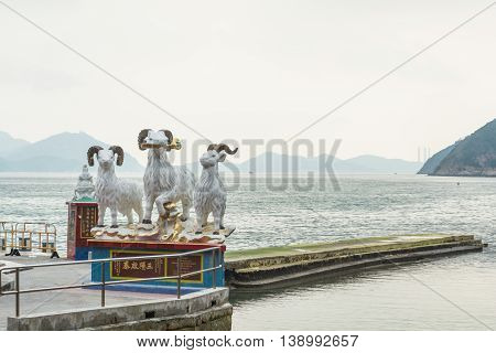 REPULSE BAY HONG KONG - MAY 23: The statues of three celestial rams presenting the jade scepter of prosperity to the people of Hong Kong in Kwun Yam temple on May 23 2016 in Repulse Bay Hong Kong.